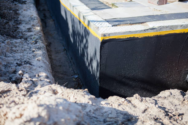 Professional Emergency Waterproofing technician working in Huntsville, AL